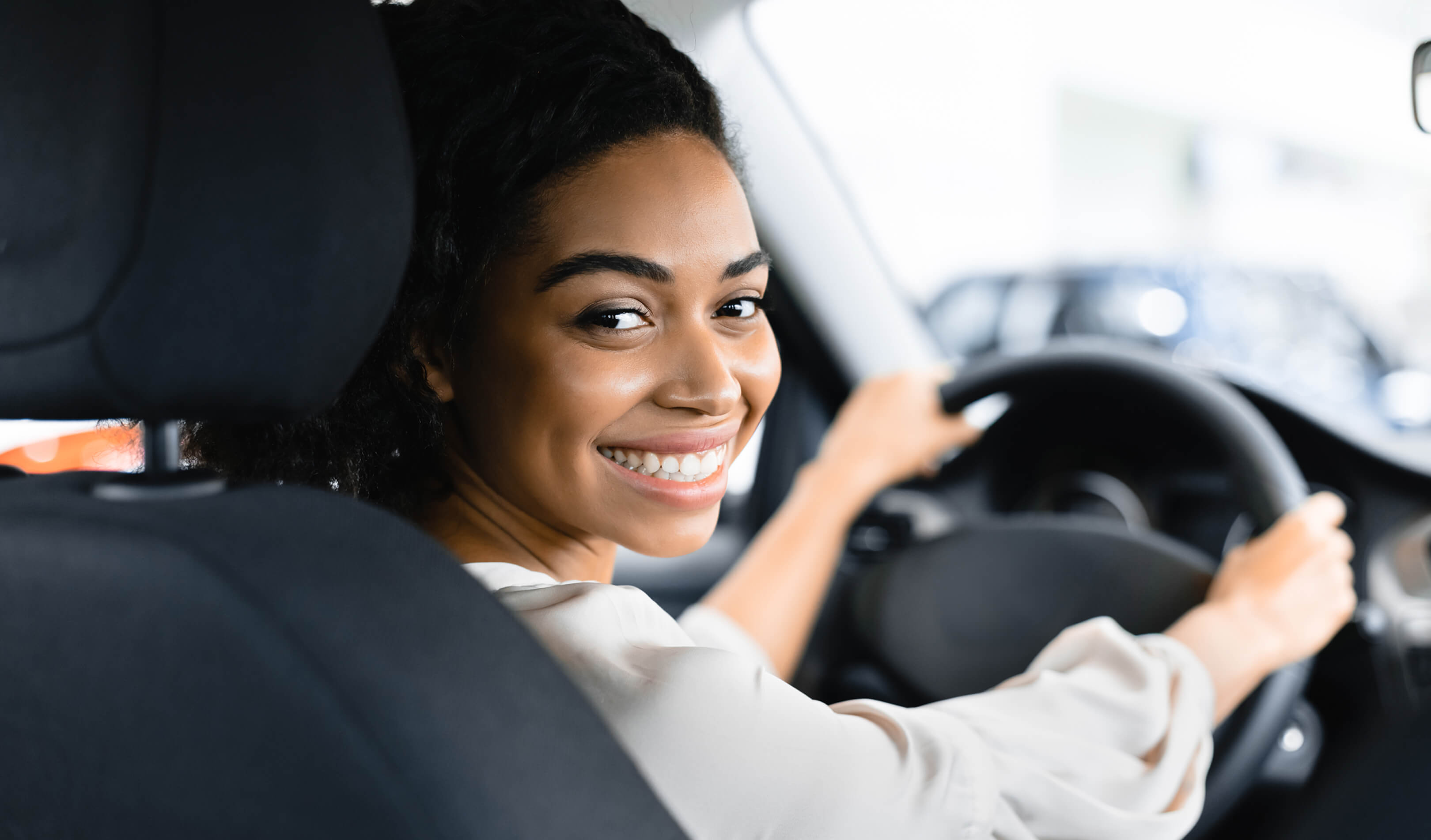 Happy women driving her car